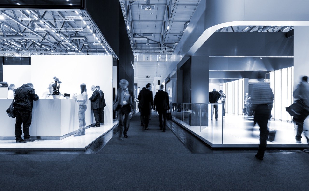 Blurred people at a trade fair